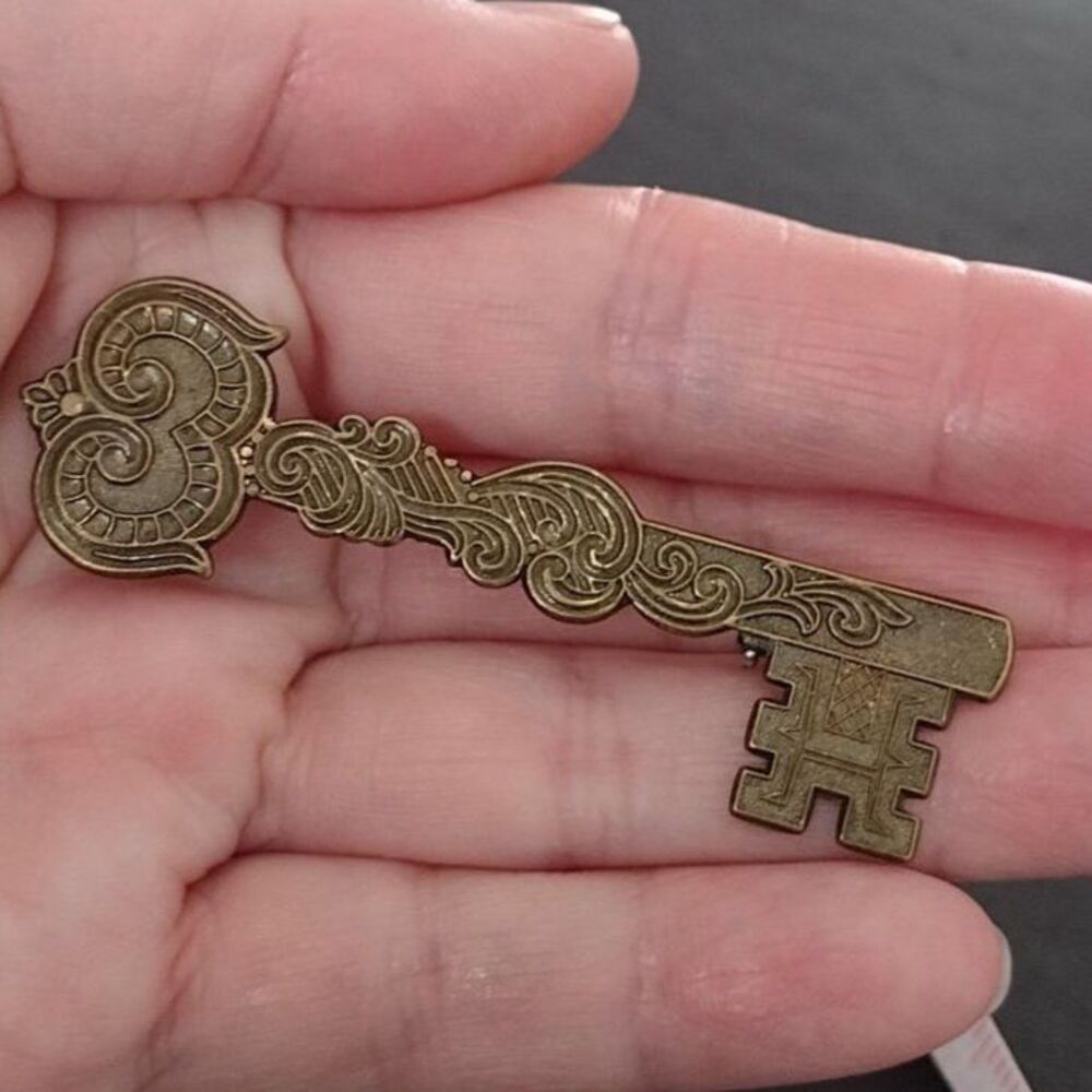 Vintage bronze tone key brooch
